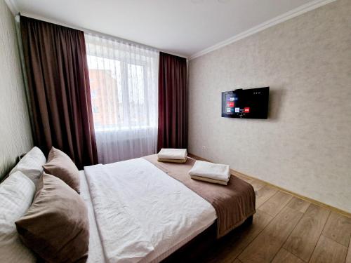 Televizorius ir (arba) pramogų centras apgyvendinimo įstaigoje Apartament on Chornovola, 40 ЖК "Варварівка"