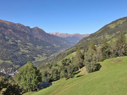 a view of a valley with trees and mountains at Natur Residence Kaiser Hans in Schenna