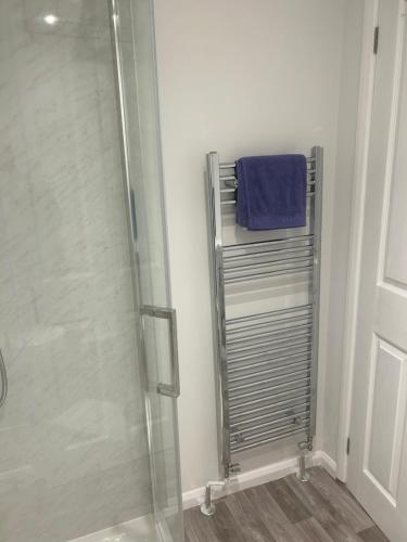a shower in a bathroom with a glass shower stall at 29a in Downham Market