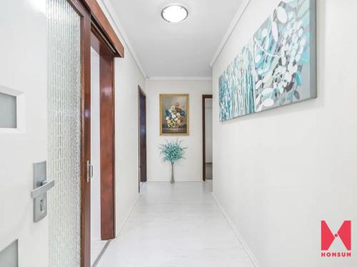a corridor in a house with a hallway at Comfortable Double room with shared kitchen and bathroom in Perth
