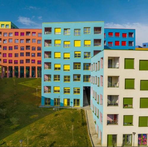 an overhead view of a building with colorful windows at Hejli's Apartment in Tirana