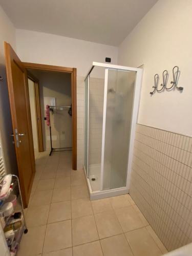 a bathroom with a shower in a room at Residence La Settima in Milano Marittima