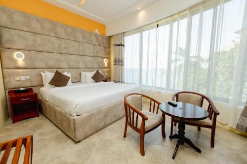Katil atau katil-katil dalam bilik di Malaika Beach Resort
