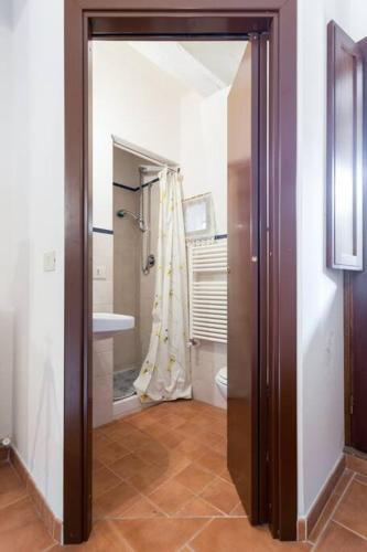 a bathroom with a shower and a toilet and a sink at La Casa nel Borgo in Stimigliano