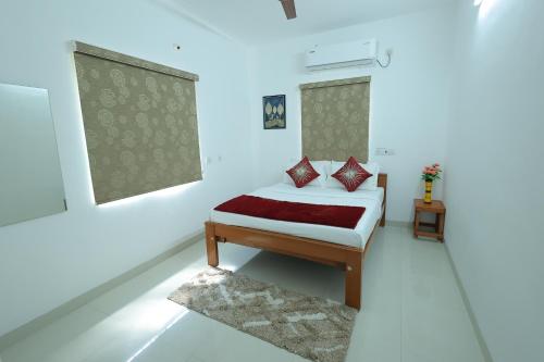 Ένα ή περισσότερα κρεβάτια σε δωμάτιο στο Royal Beach Service Apartment