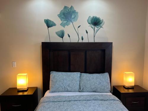 a bedroom with a bed with two lamps on it at Ancla Suites Urban Hotel - 6 in Puerto Peñasco