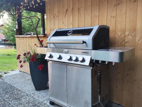 a barbecue grill with a stove and a grill at Alpflower in Halblech