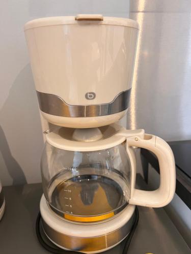 a coffee maker sitting on top of a table at Studio tout confort 2 personnes au coeur de l'Alsace in Wolxheim
