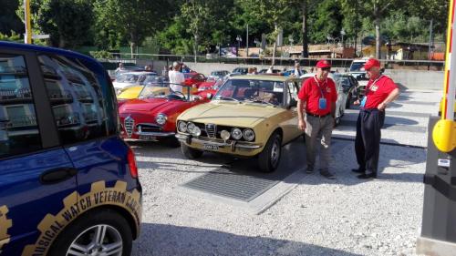 two men standing in front of a group of cars at Hotel Sans Souci in Gabicce Mare