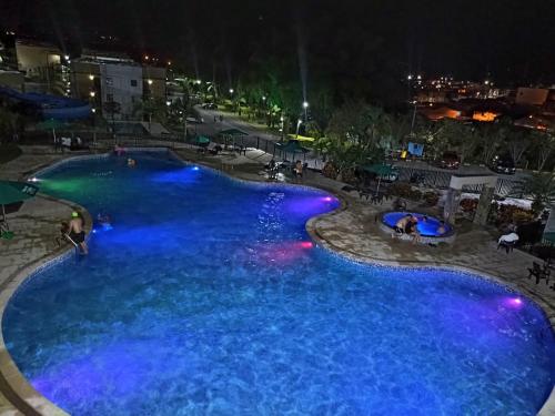 an overhead view of a pool at night at Apartasol Amor y Café, Reserva de la Colina in La Tebaida