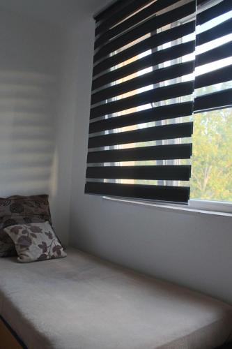 Una cama o camas en una habitación de Dino's apartment