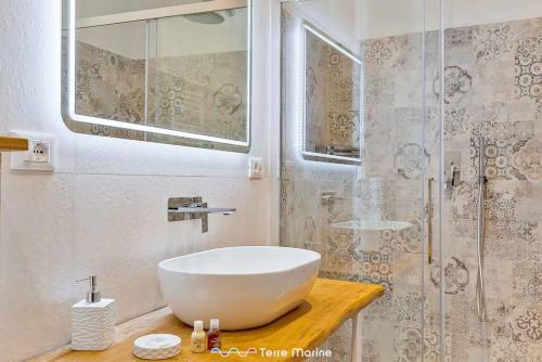 a bathroom with a large white sink and a shower at XX di Mare, Terre Marine in Monterosso al Mare