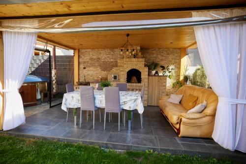 a living room with a table and a couch at Comfy House in Borşa