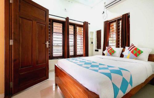 Voodi või voodid majutusasutuse Flagship Atharvam Resort toas