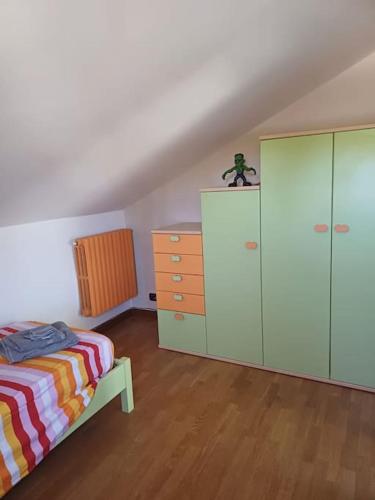 a bedroom with a bed and a dresser at Campo del Gatto in Viterbo