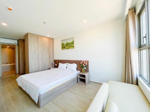 Ένα ή περισσότερα κρεβάτια σε δωμάτιο στο The Sóng Apartment Vũng Tàu - Sophia's House