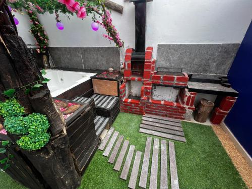 a model of a bathroom with a fireplace and grass at Departamento Inteligente con Jacuzzi Privado en Zapopan in Guadalajara