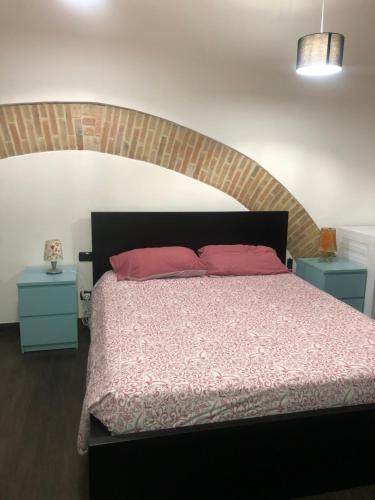 Ένα ή περισσότερα κρεβάτια σε δωμάτιο στο Vacanza in Chianti