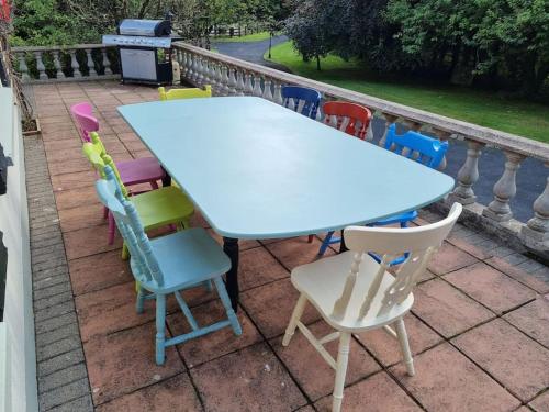 a table and chairs sitting on a patio at Gap Retreat in Carrickmore