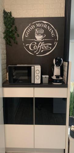 Kemudahan buat kopi dan teh di L&D -Parking Incluido-