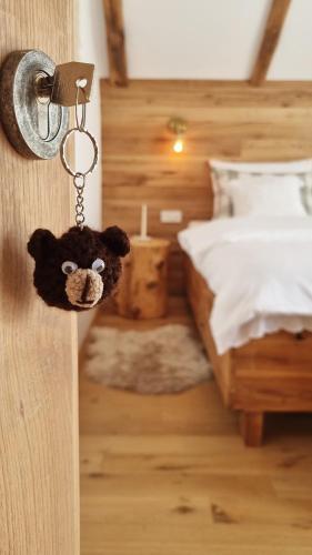 a teddy bear key to a bedroom door at Guest Accommodation Butina in Kuterevo