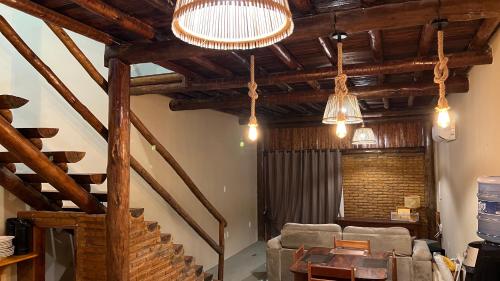 a living room with a couch and a table at Apartamento Beira Mar Preá in Prea