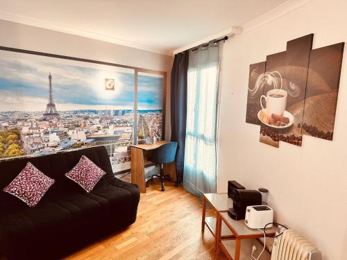 a living room with a black couch and a large window at Ryan Homes - in Apart hotel, La Défense in Courbevoie