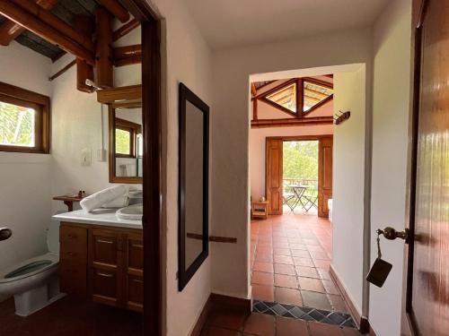 a bathroom with a sink and a toilet at Finca Hotel Santana in Montenegro
