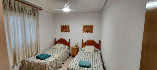 Postel nebo postele na pokoji v ubytování Apartamento Salamanca 38 en Santa Pola