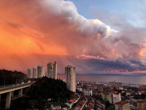 a cloudy sky over a city with buildings at Apartman Luna *** in Rijeka