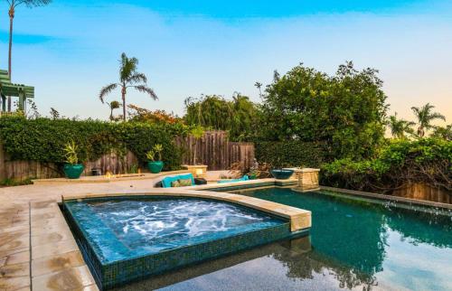 a swimming pool in the middle of a yard at Breathtaking La Playa Getaway With Golf Cart Use! in San Diego