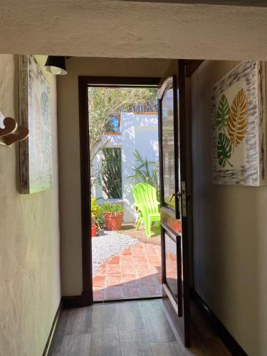 a hallway with a door open to a patio at Apart Los Cerrillos in Balcarce