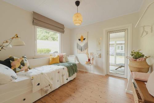 a bedroom with a bed and a large window at Chalet Panor'Anna in Saint-Vith