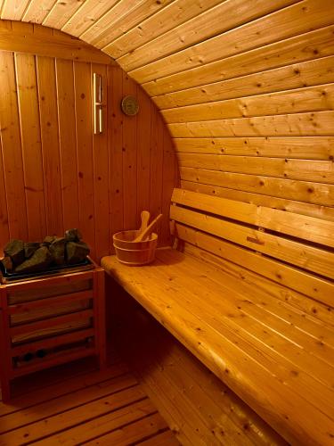 a sauna with a bench in a wooden room at Chalet Panor'Anna in Saint-Vith