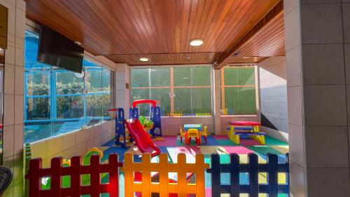 a room with a play room with a playground at Hotel Palazzo Reale in Campos do Jordão