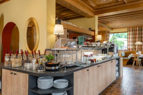 a kitchen with a counter with dishes on it at Gästehaus Hochkönig in Filzmoos