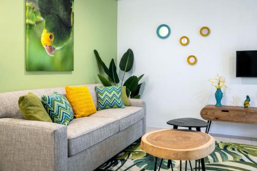 a living room with a couch and a table at Diver's Paradise Bonaire in Kralendijk