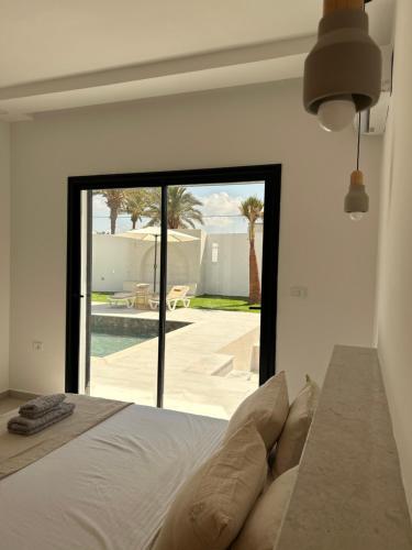 Ένα ή περισσότερα κρεβάτια σε δωμάτιο στο Dar El Salem Villa de Haut Standing