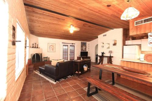 a living room with a couch and a table at Cozy Adobe in Pahrump