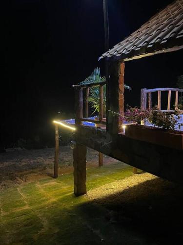 a gazebo at night with lights on it at CABAÑAS EL PARAISO PESCADERITO in Curití