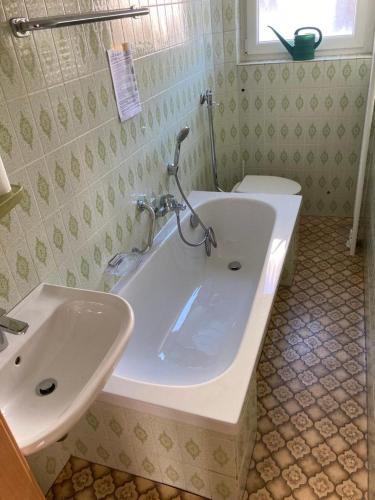 a bathroom with a white sink and a toilet at Vacation home for up to 6 guests 