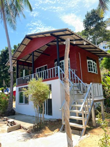 a red and white house on the beach at Rasta view Bangalows in Ko Chang