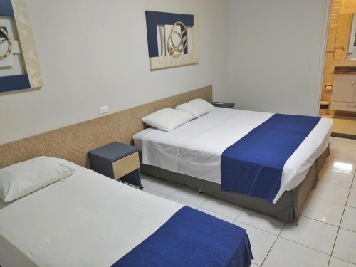 Postel nebo postele na pokoji v ubytování Riviera de São Lourenço Flat