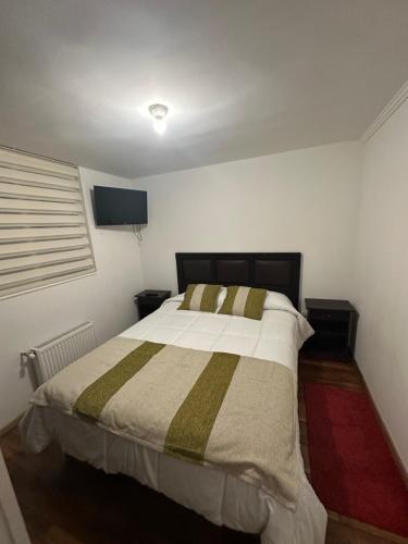 Katil atau katil-katil dalam bilik di Apartamento punta Arenas