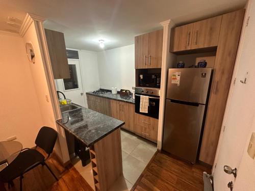 Dapur atau dapur kecil di Apartamento punta Arenas