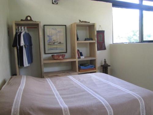Postel nebo postele na pokoji v ubytování Centro Sati Bungalow