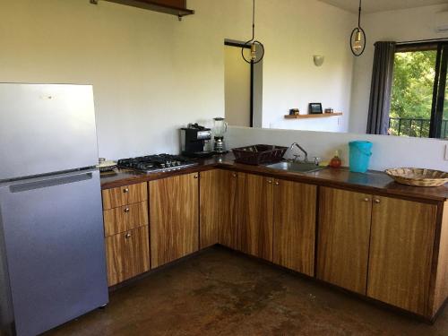 Kuchyň nebo kuchyňský kout v ubytování Centro Sati Bungalow