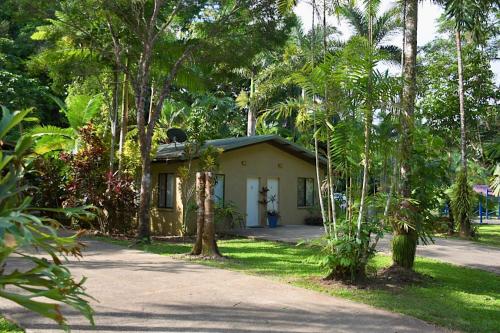 a small house in the middle of some trees at Daintree Siesta in Diwan