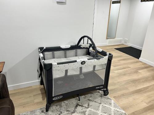a tool cart sitting on the floor in a room at Vinash Luxury Suite in Edmonton