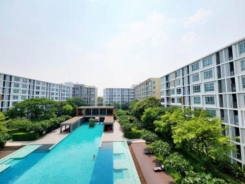 an overhead view of a swimming pool in a building at 2 Bedrooms 2 bath Apartment in Chiang Mai